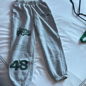 Gray Land Rover sweatpants with green details